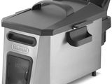 a close up of an electric deep fryer on a white background