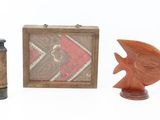 a small wooden box with a fish and a small wooden box with a fish on it