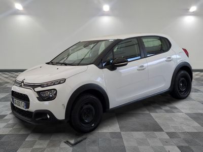 the white citrole is parked on a checkered floor