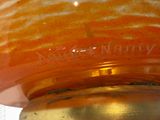 a close up of a vase with a label on it