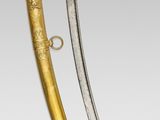 an image of a gold and silver sword on a white background