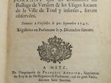 a book with a picture of a coat of arms on it
