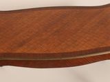 an image of a small table with a wooden top on a white background
