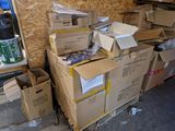 a pile of boxes sitting on the floor in a garage