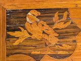 a wooden box with a bird on it