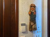 a clock on the wall next to a door in a bathroom