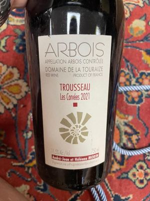a bottle of wine that is being held by a person