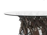 a close up of a table with a glass top and metal legs