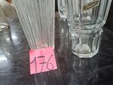 a glass vase and a glass vase with a price tag on it