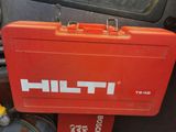 a red tool box sitting on the back of a car