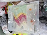 a pile of clothes and other items in a plastic bag