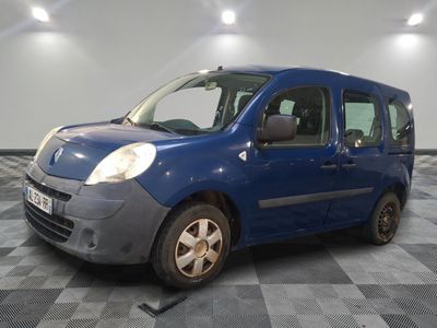 a picture of a small blue van parked in a garage