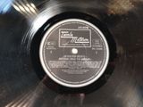an image of a record with a label on it sitting on top of a table