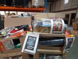 a pile of assorted items sitting on a carton in a warehouse
