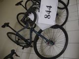 a bicycle that is laying on the floor with a price tag