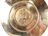 a person holding a glass of water in their hand