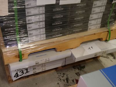 a large stack of boxes on a pallet in a warehouse