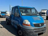 a blue truck that is parked in a parking lot