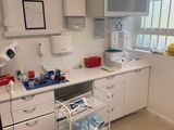 an image of a hospital room with a sink and medical equipment