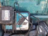 a picture of a tool box with a cordless driller and a charger