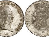 a silver coin with a crown on the front and a crown on the back