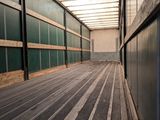 an image of a long hallway in an industrial building