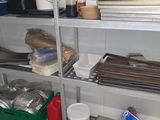 a metal shelving with many items on top of it
