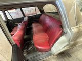 two red seats in the back of a car
