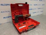 a red tool box with tools in it sitting on a table