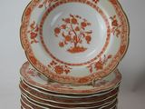 many plates stacked on top of each other on a table