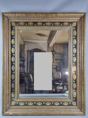 a picture of a mirror hanging on the wall