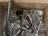 a box full of wrenches and other tools in it