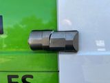 a close up of a fuel pump with a green background