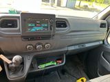 the interior of a car with a steering control and dashboard controls
