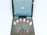 silverware in a case with four spoons in it