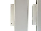 pair of white speakers on a white wall with a white background