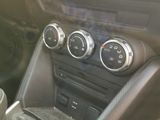 a picture of a car dashboard with the control buttons on
