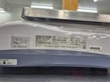 a close up of a machine with labels on it
