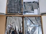 four boxes of electronic equipment in a box on a table