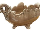 a large bowl that has a ram head on it