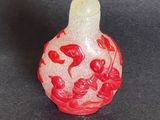 chinese red and white glass snuff bottle with floral decoration