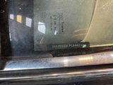 a close up of a car ' s rear window with a sticker on it