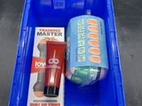 a blue container with a toothbrush, toothpaste and a tube of toothpaste on it