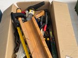 a box full of tools sitting on the floor