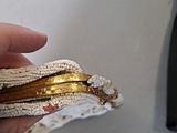 a person holding a piece of food in their hand