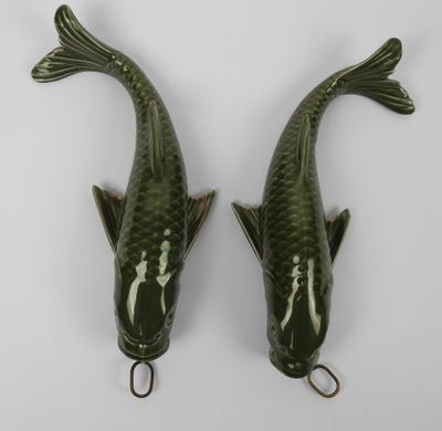 pair of green ceramic koi fish wall hangings