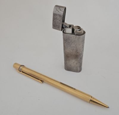 an image of a lighter and a pen on a white surface