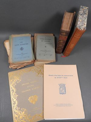 several books are stacked on top of each other on a table