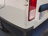 a white truck that is parked on the side of the road