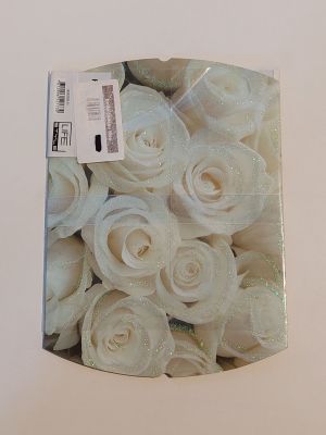 a box with a bunch of white roses inside of it